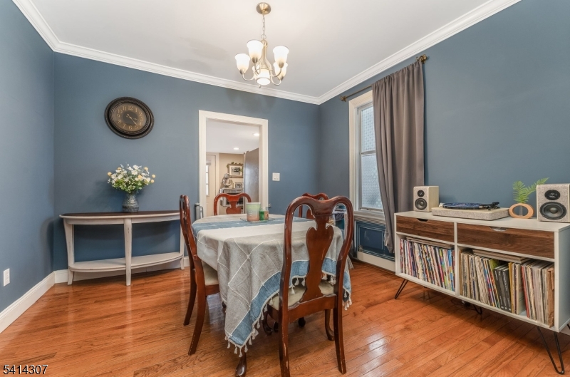 409 Boonton Avenue Boonton, NJ 07005 - Photo 14 of 43 a dining room with furniture a chandelier and wooden floor