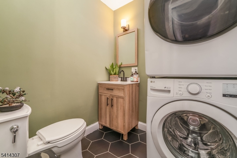 409 Boonton Avenue Boonton, NJ 07005 - Photo 16 of 43 a bathroom with a sink mirror vanity and toilet