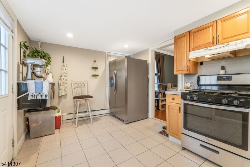 409 Boonton Avenue Boonton, NJ 07005 - Photo 19 of 43 a kitchen with stainless steel appliances granite countertop a refrigerator and a stove top oven