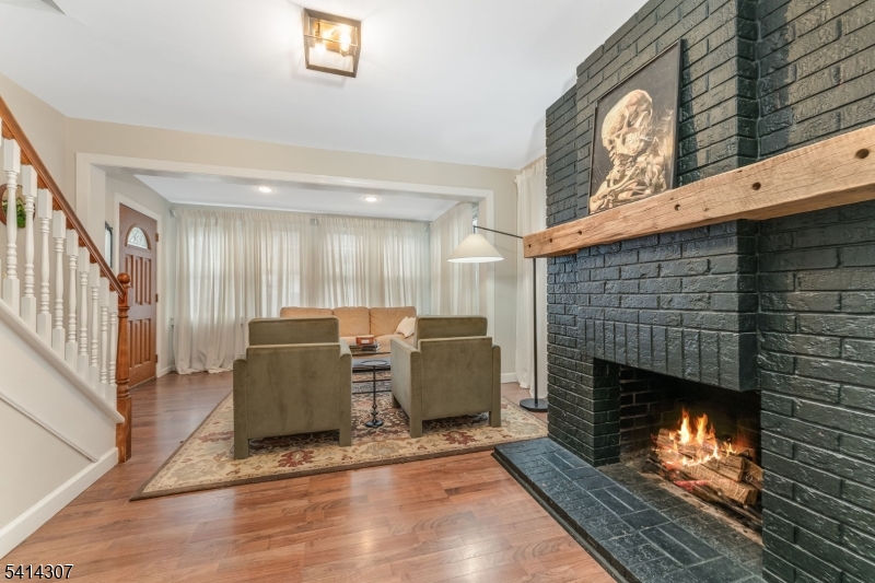 409 Boonton Avenue Boonton, NJ 07005 - Photo 30 of 43 a living room with furniture and a fireplace