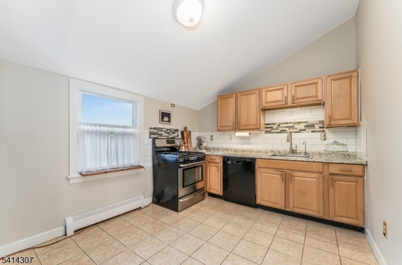 409 Boonton Avenue Boonton, NJ 07005 - Photo 36 of 43 a kitchen with stainless steel appliances granite countertop a stove sink and cabinets