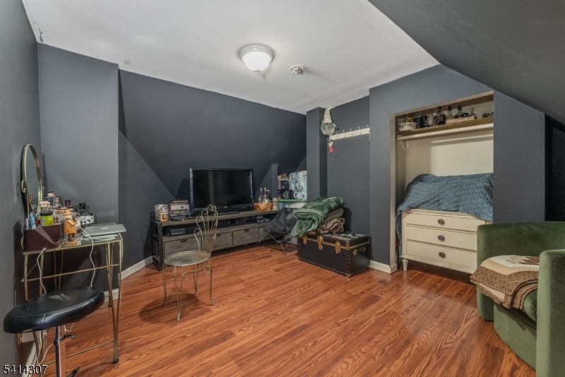 409 Boonton Avenue Boonton, NJ 07005 - Photo 42 of 43 a room with furniture and a wooden floor