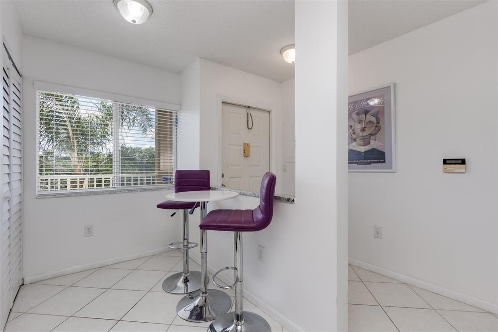 9537 Weldon Circle, Unit 404 Fort Lauderdale, FL 33321 - Photo 18 of 39 a room with furniture and windows
