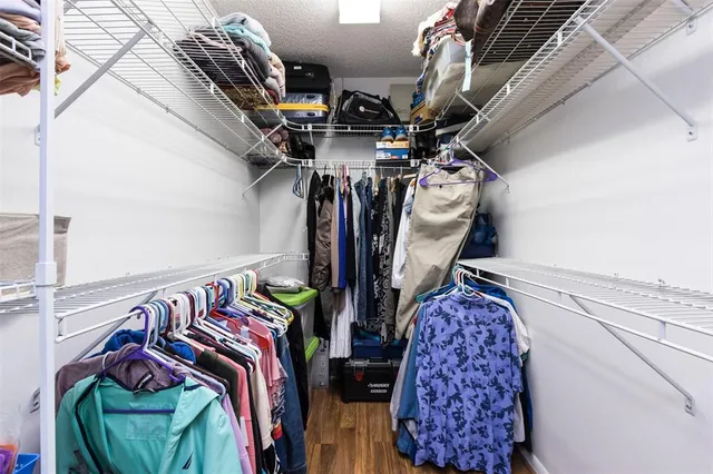 a view of room with window and wooden floor
