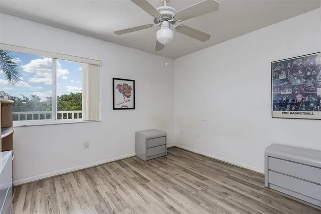 a view of a livingroom with racks on the wall