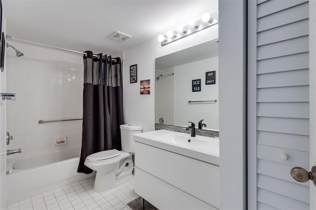 9537 Weldon Circle, Unit 404 Fort Lauderdale, FL 33321 - Photo 30 of 39 a bathroom with a sink toilet and shower