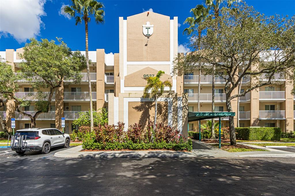9537 Weldon Circle, Unit 404 Fort Lauderdale, FL 33321 - Photo 38 of 39 front view of a building with a street