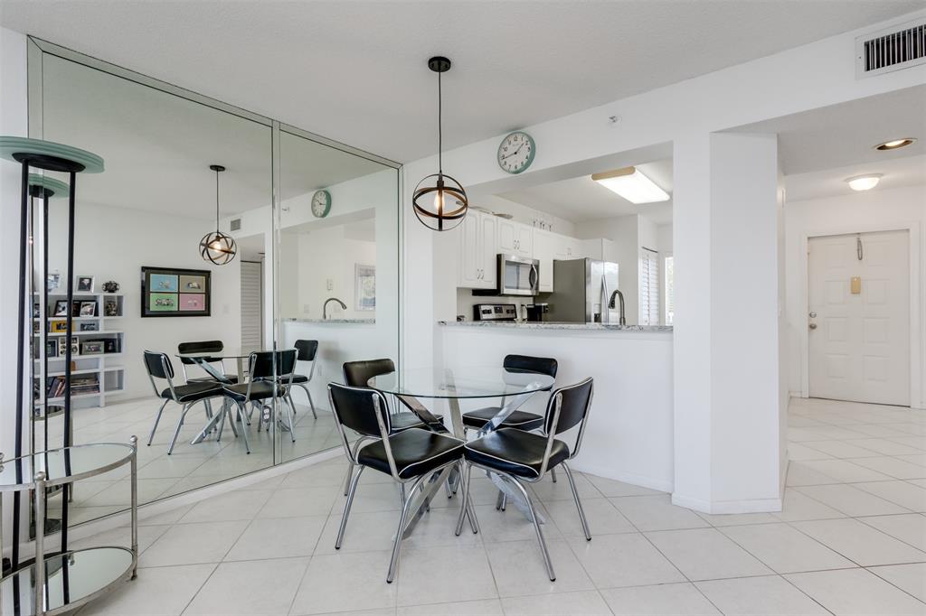 9537 Weldon Circle, Unit 404 Fort Lauderdale, FL 33321 - Photo 7 of 39 a view of a dining room with furniture