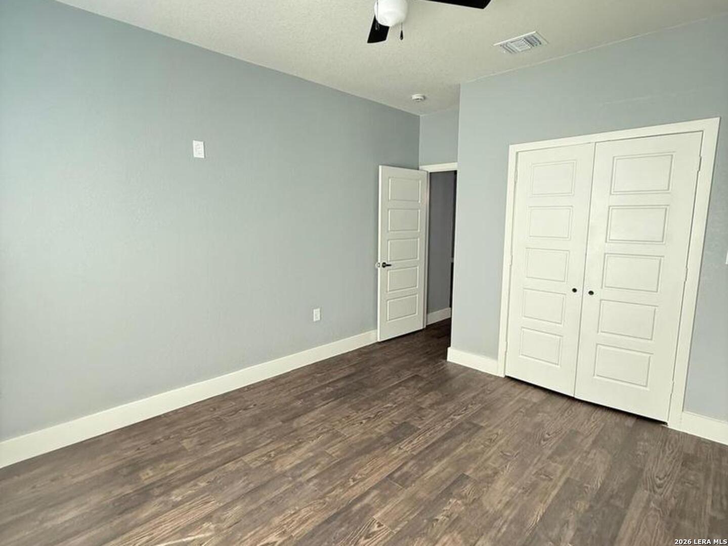 802 Cr 520 D'Hanis, TX 78850 - Photo 14 of 33 a view of an empty room with wooden floor