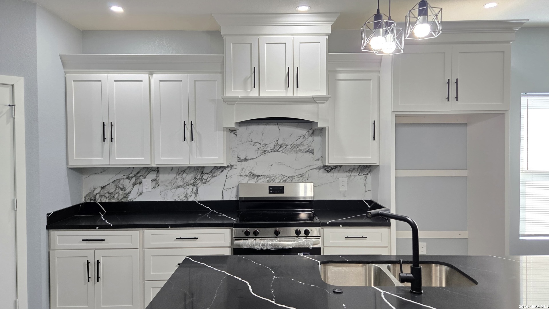 802 Cr 520 D'Hanis, TX 78850 - Photo 21 of 33 a kitchen with a stove and cabinets