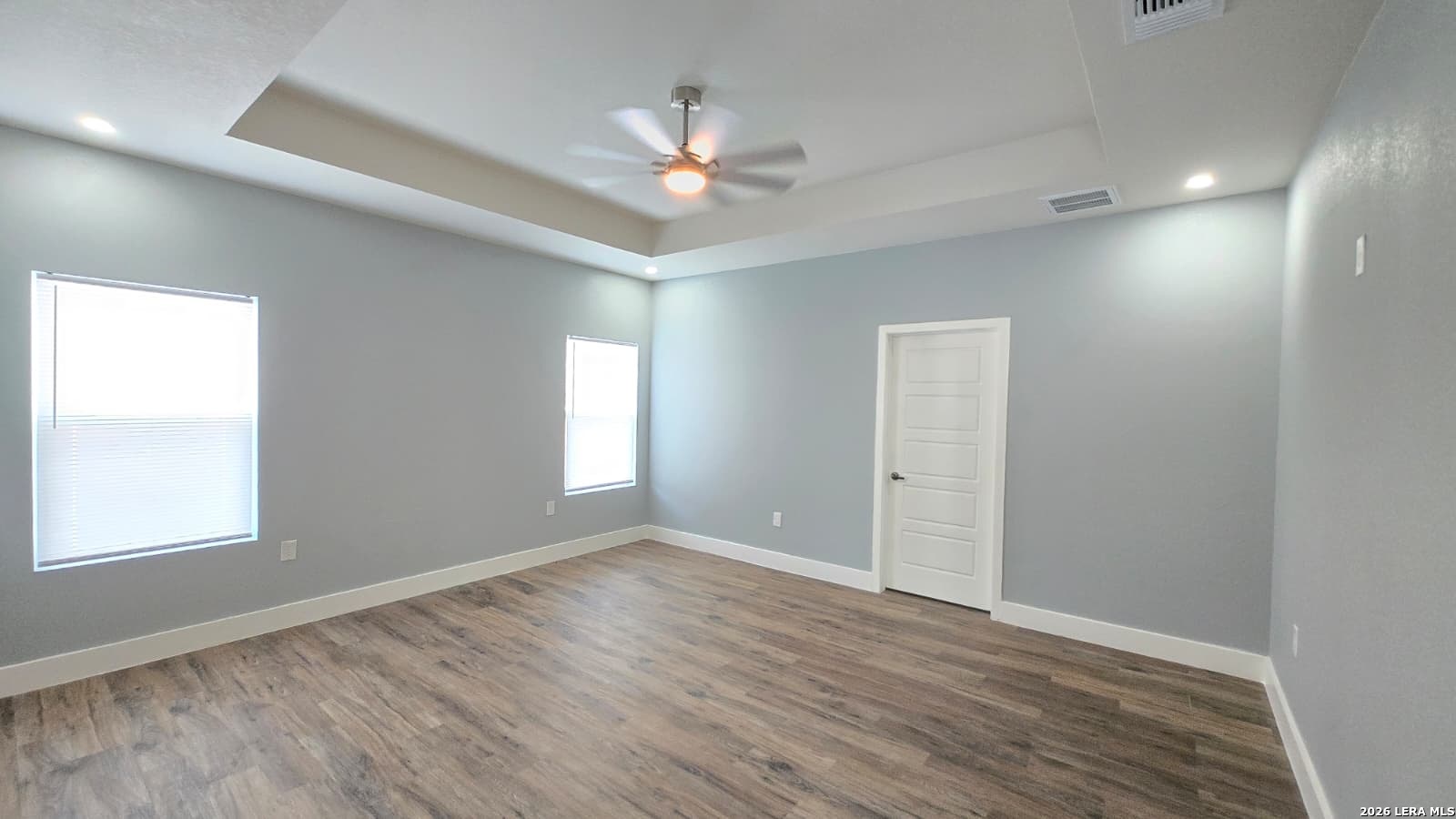 802 Cr 520 D'Hanis, TX 78850 - Photo 31 of 33 wooden floor in an empty room with a window
