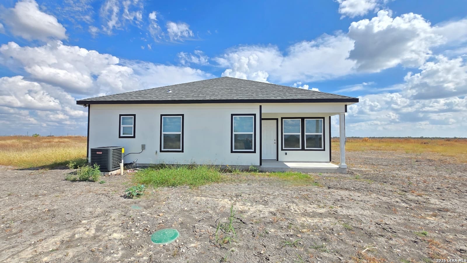 802 Cr 520 D'Hanis, TX 78850 - Photo 33 of 33 a backyard of a house with plants and large tree
