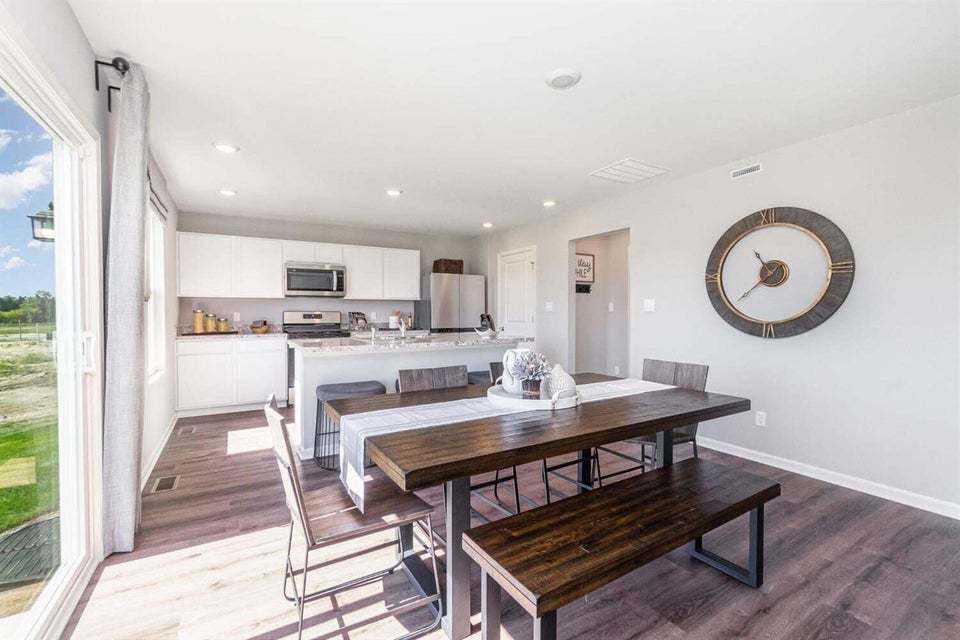 615 Ensign Place Hebron, IN 46341 - Photo 11 of 29 a view of a dining room with furniture and a rug