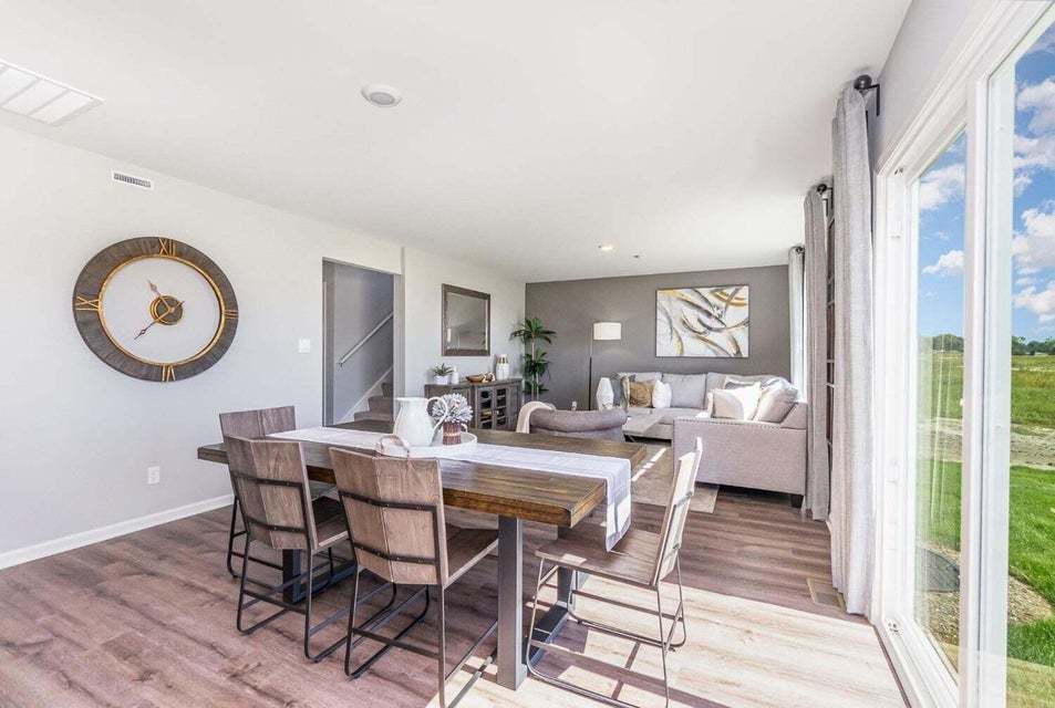 615 Ensign Place Hebron, IN 46341 - Photo 13 of 29 a view of a dining room with furniture and a large window