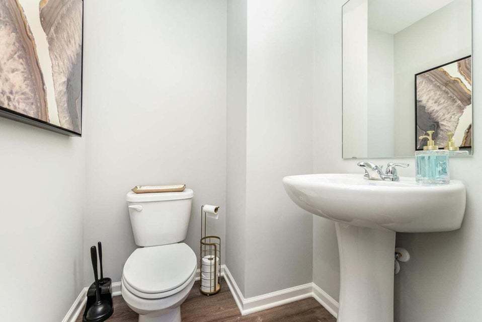 615 Ensign Place Hebron, IN 46341 - Photo 18 of 29 a bathroom with a toilet a sink and mirror
