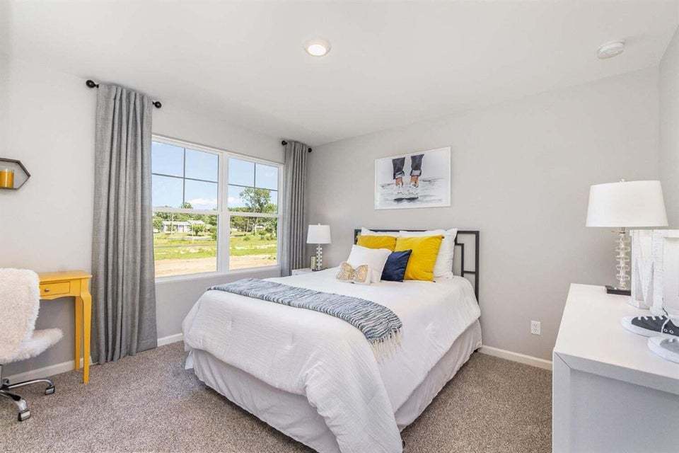 615 Ensign Place Hebron, IN 46341 - Photo 22 of 29 a bedroom with a bed and a table