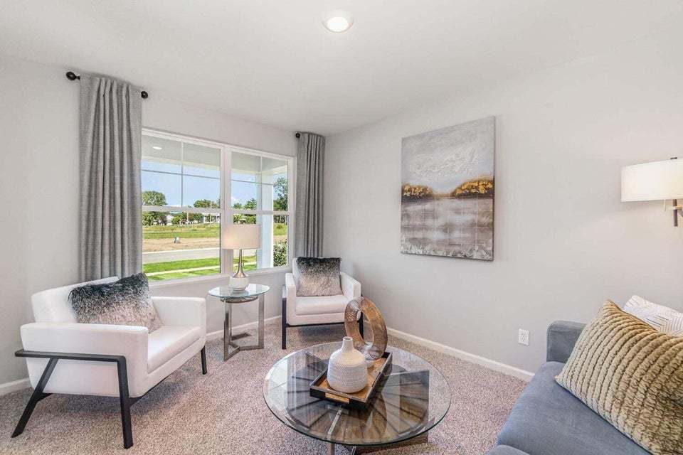 615 Ensign Place Hebron, IN 46341 - Photo 5 of 29 a living room with furniture and a potted plant