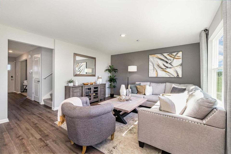 615 Ensign Place Hebron, IN 46341 - Photo 8 of 29 a living room with furniture and a large window