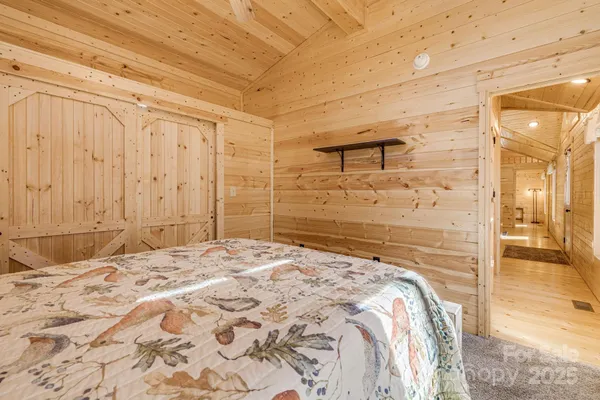 a bedroom with a bed and a bathroom