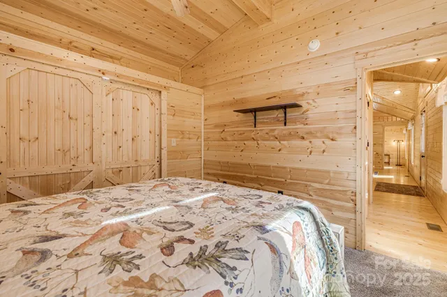 a bedroom with a bed and a bathroom