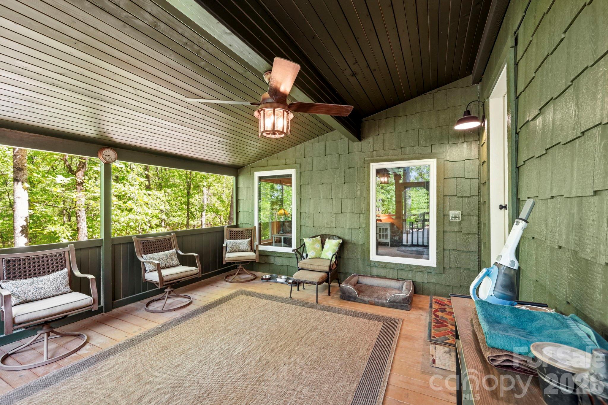 81 Delind Drive Mill Spring, NC 28756 - Photo 22 of 40 a living room with furniture and a large window