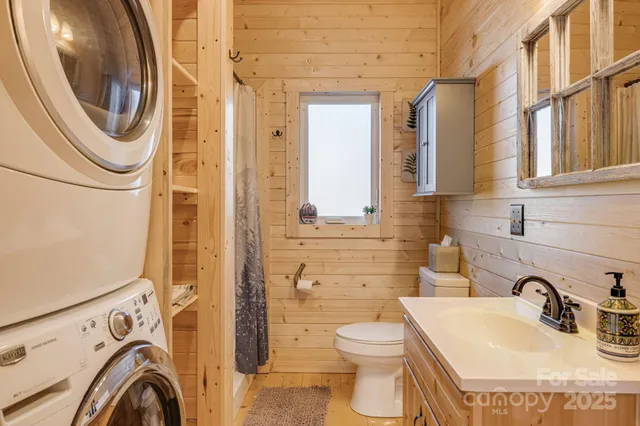 a bathroom with a sink a mirror and shower