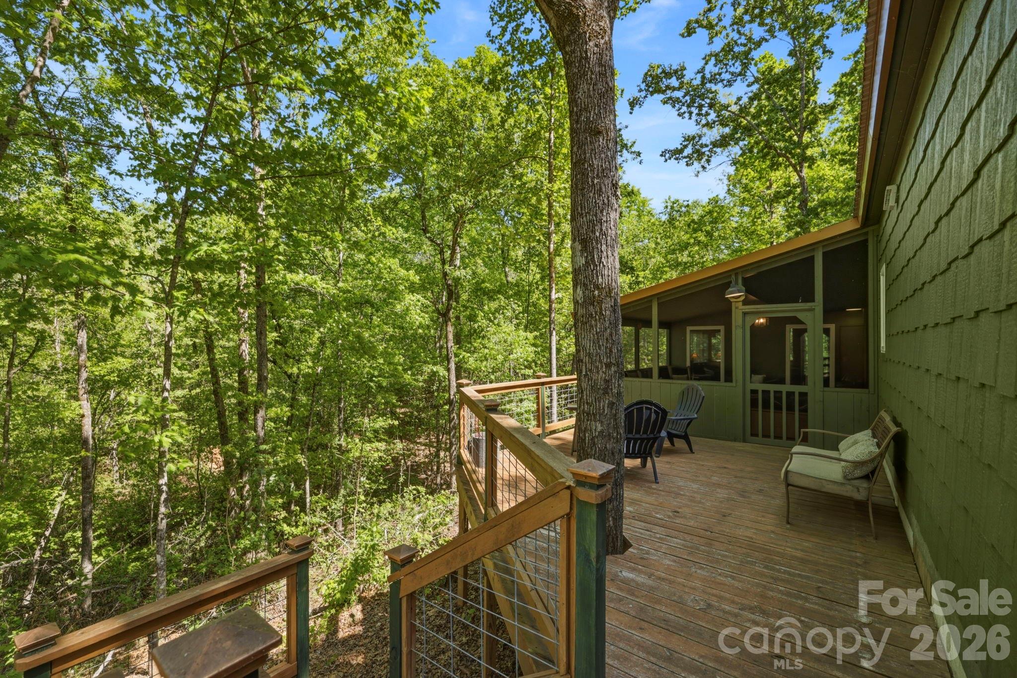 81 Delind Drive Mill Spring, NC 28756 - Photo 24 of 40 a view of a balcony with chairs