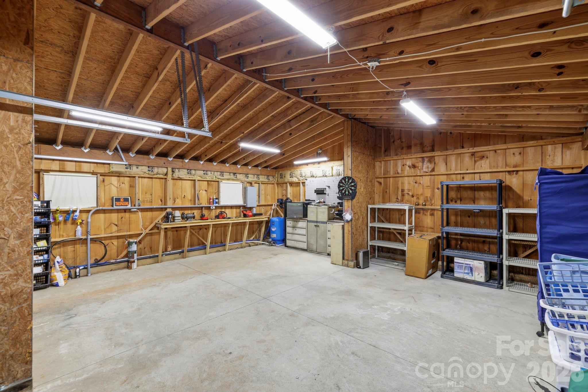 81 Delind Drive Mill Spring, NC 28756 - Photo 26 of 40 a view of water heater room with wooden ceiling