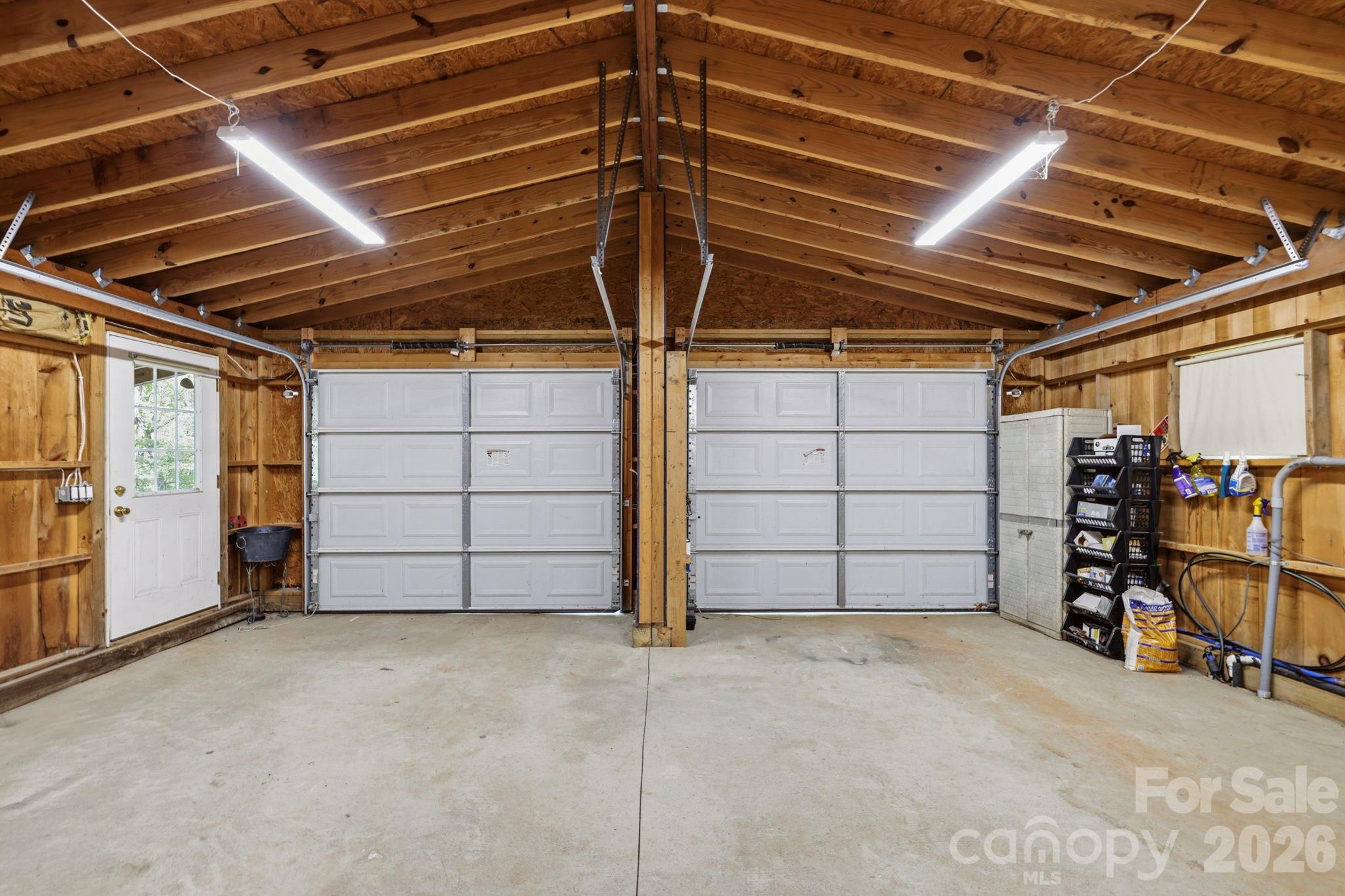 81 Delind Drive Mill Spring, NC 28756 - Photo 27 of 40 a view of a garage room with an empty space