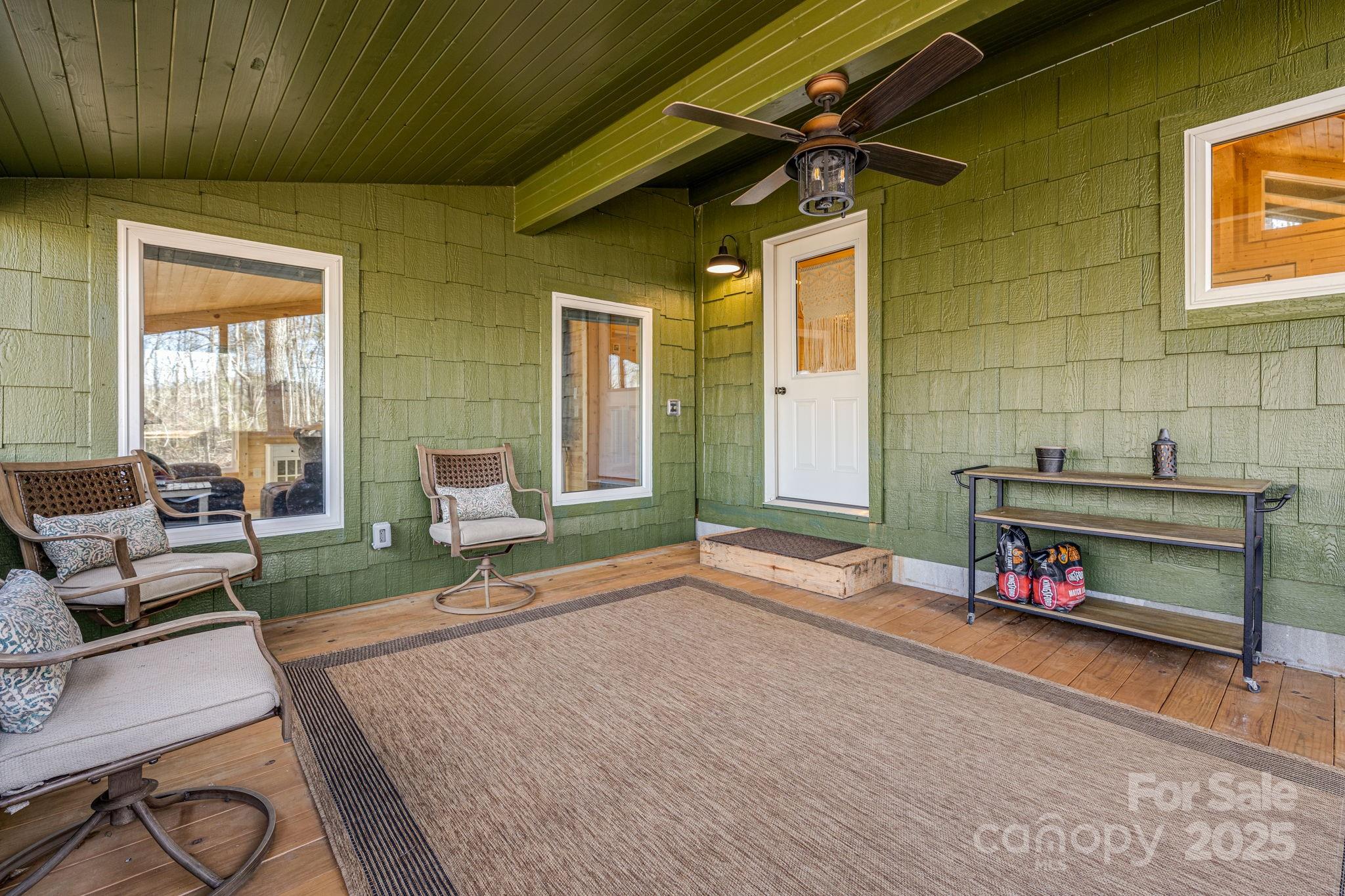 81 Delind Drive Mill Spring, NC 28756 - Photo 28 of 40 a backyard of a house with sofas