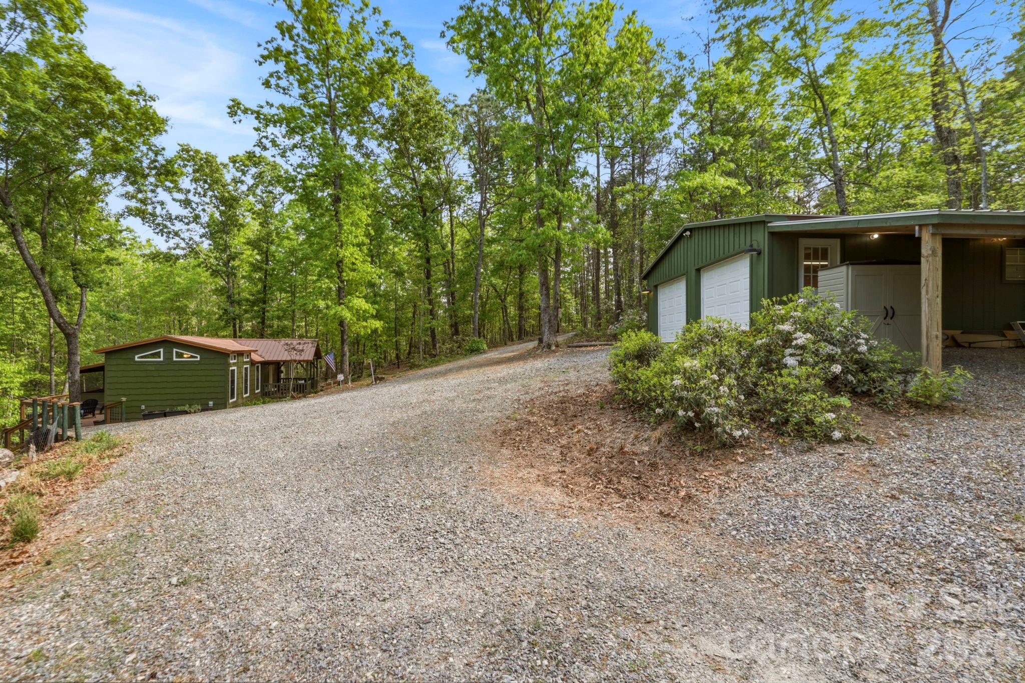 81 Delind Drive Mill Spring, NC 28756 - Photo 29 of 40 front view of a house with a tree