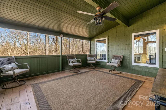 a view of a chair and tables front of the house
