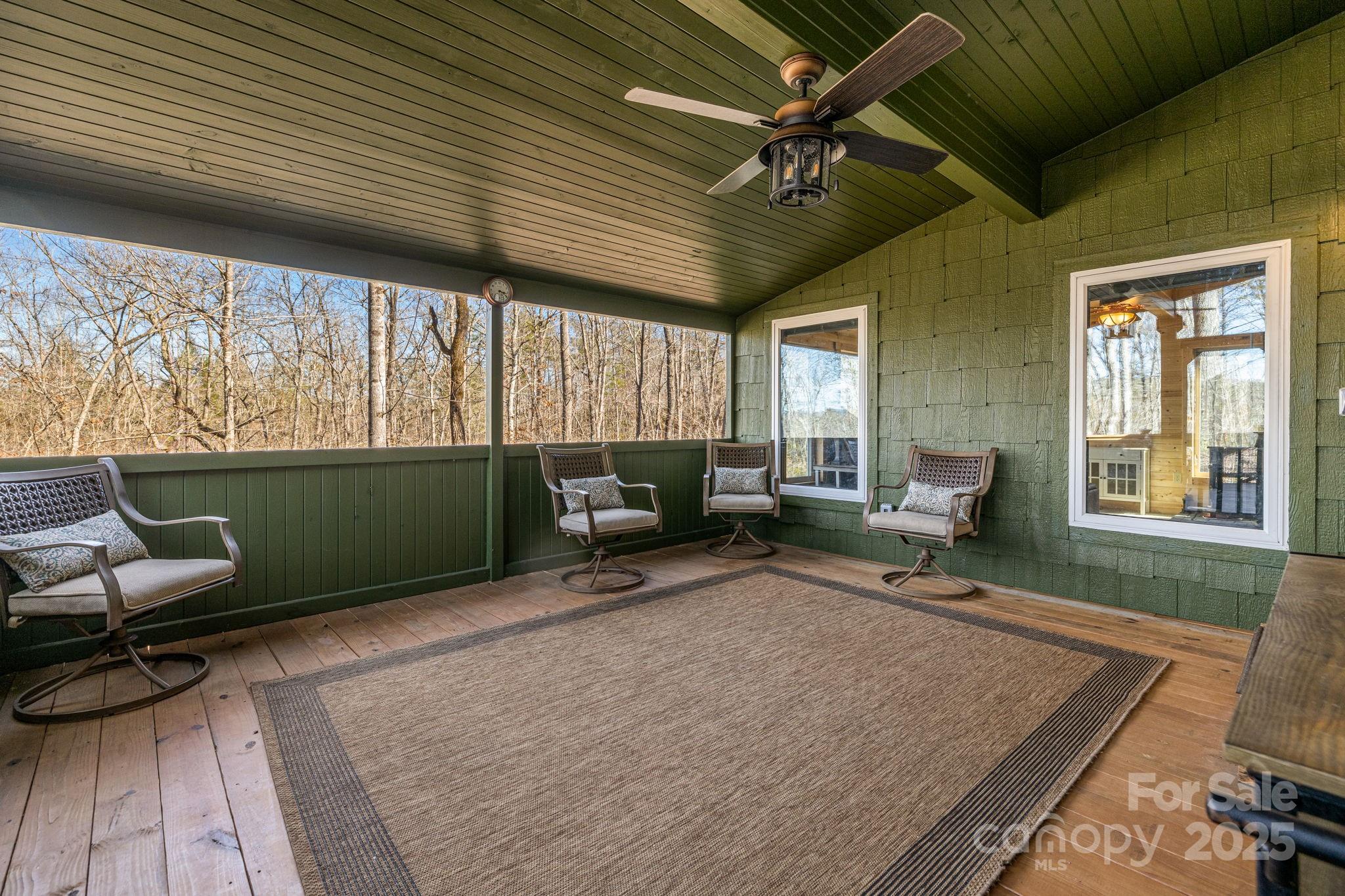81 Delind Drive Mill Spring, NC 28756 - Photo 29 of 40 a living room with furniture and a large window