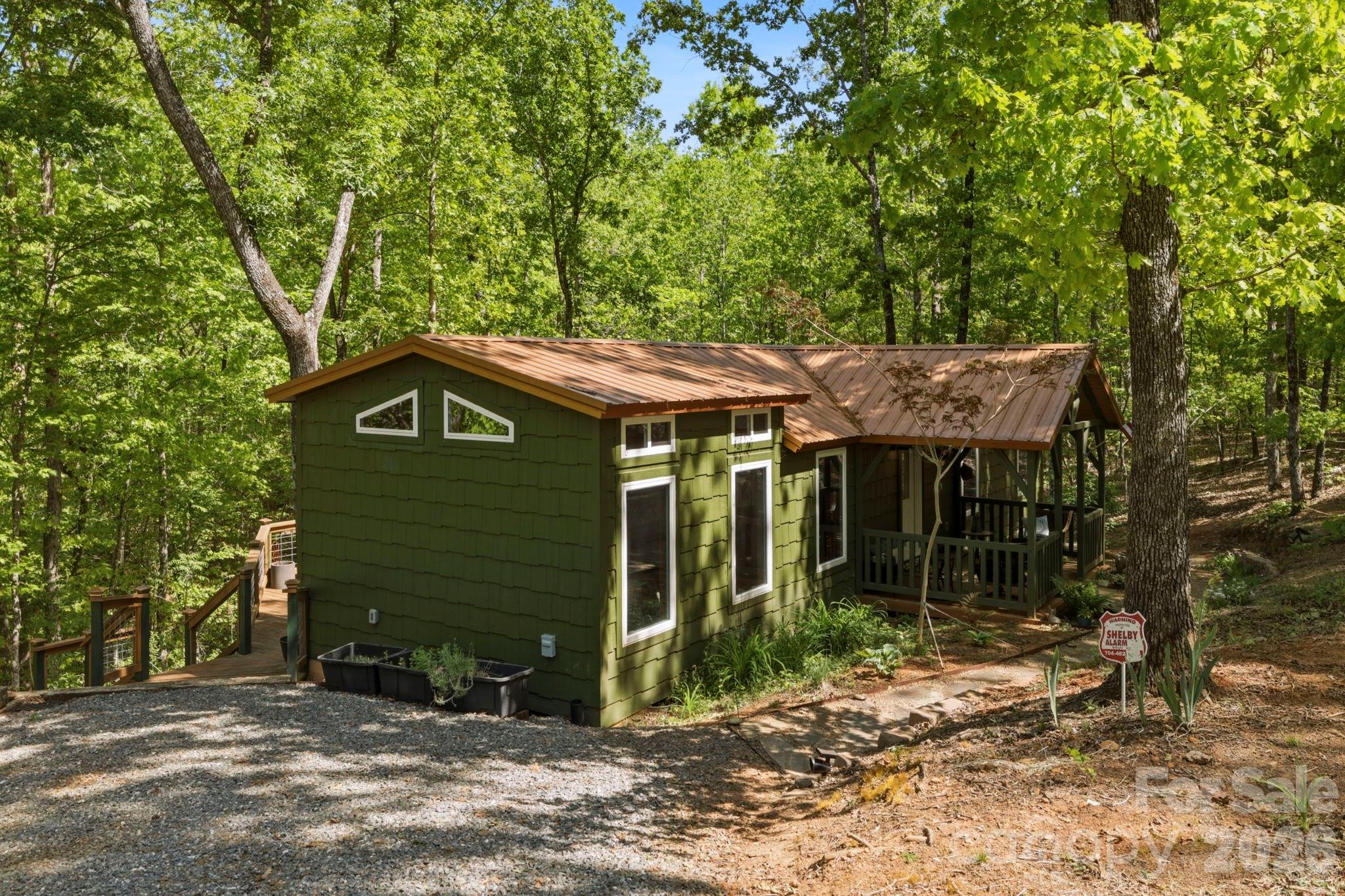 81 Delind Drive Mill Spring, NC 28756 - Photo 35 of 40 a view of a house with a yard