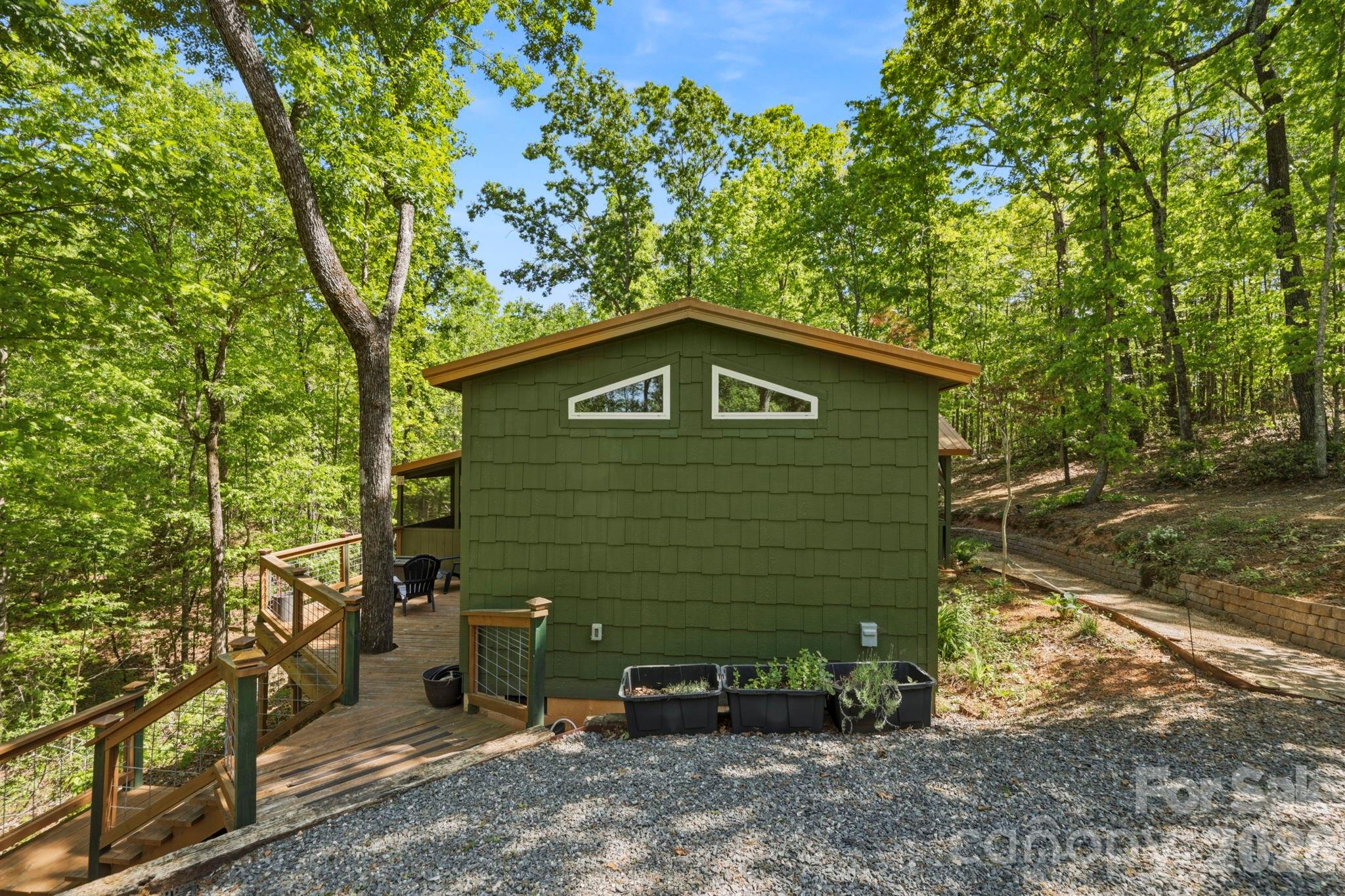 81 Delind Drive Mill Spring, NC 28756 - Photo 36 of 40 a view of a backyard with a tree