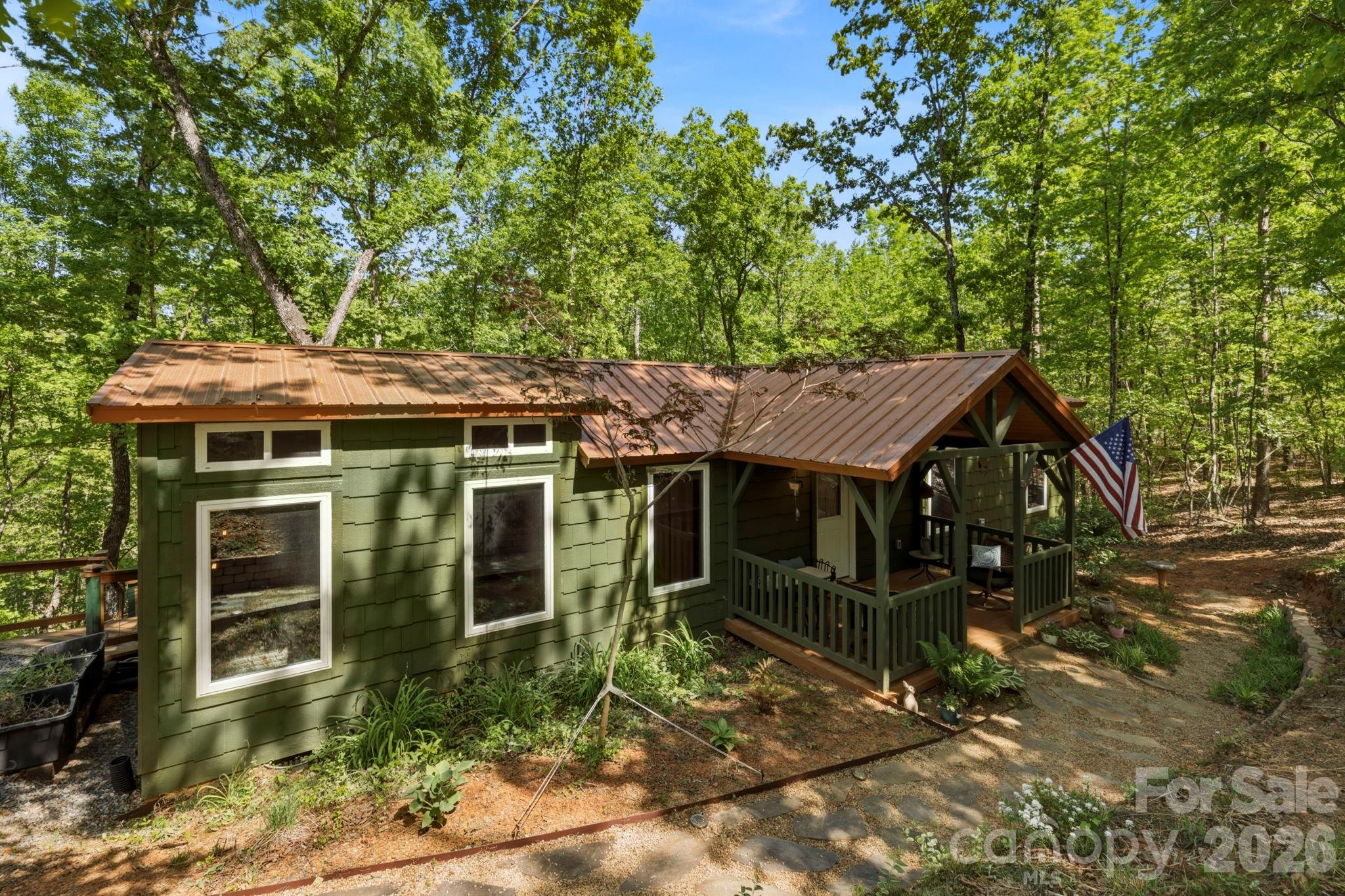81 Delind Drive Mill Spring, NC 28756 - Photo 38 of 40 a view of a house with a yard