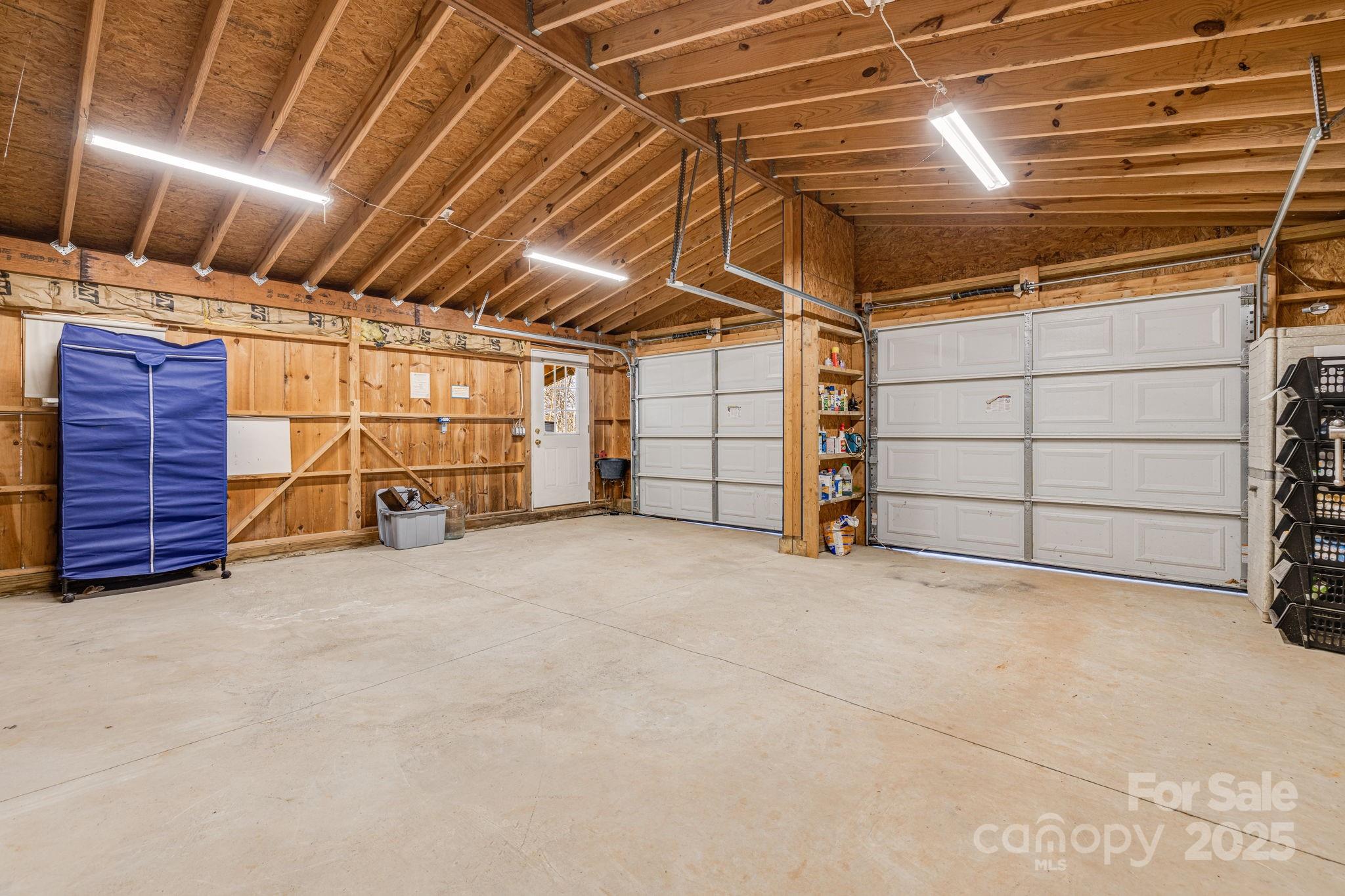 81 Delind Drive Mill Spring, NC 28756 - Photo 38 of 40 a view of a garage room with an empty space