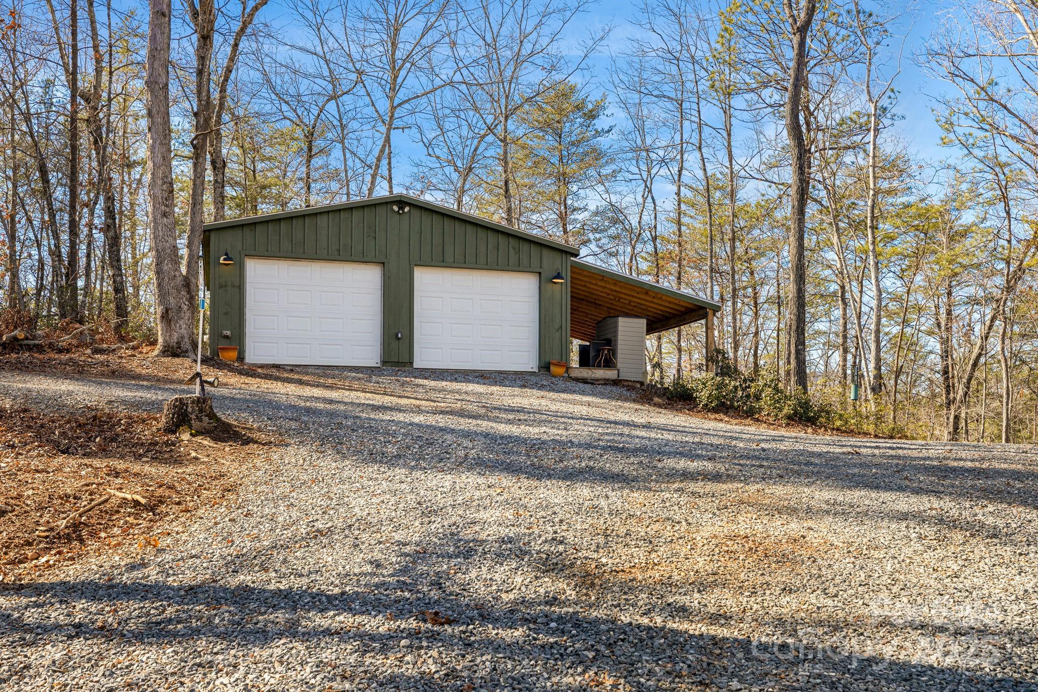 81 Delind Drive Mill Spring, NC 28756 - Photo 39 of 40 a view of a house with a yard