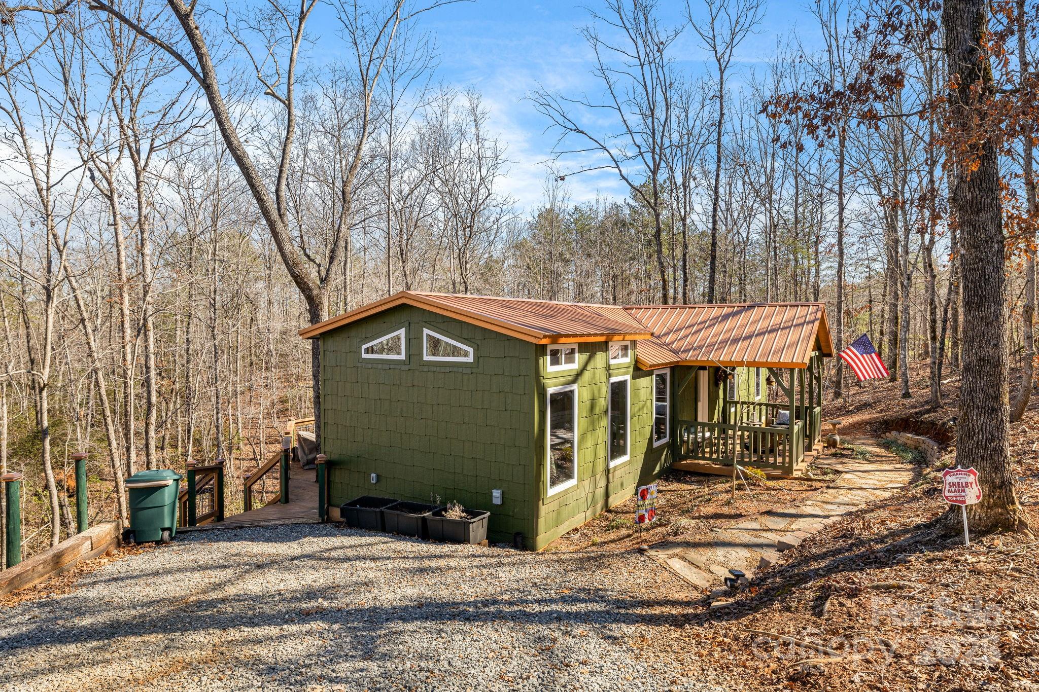 81 Delind Drive Mill Spring, NC 28756 - Photo 4 of 40 a view of a house with a yard