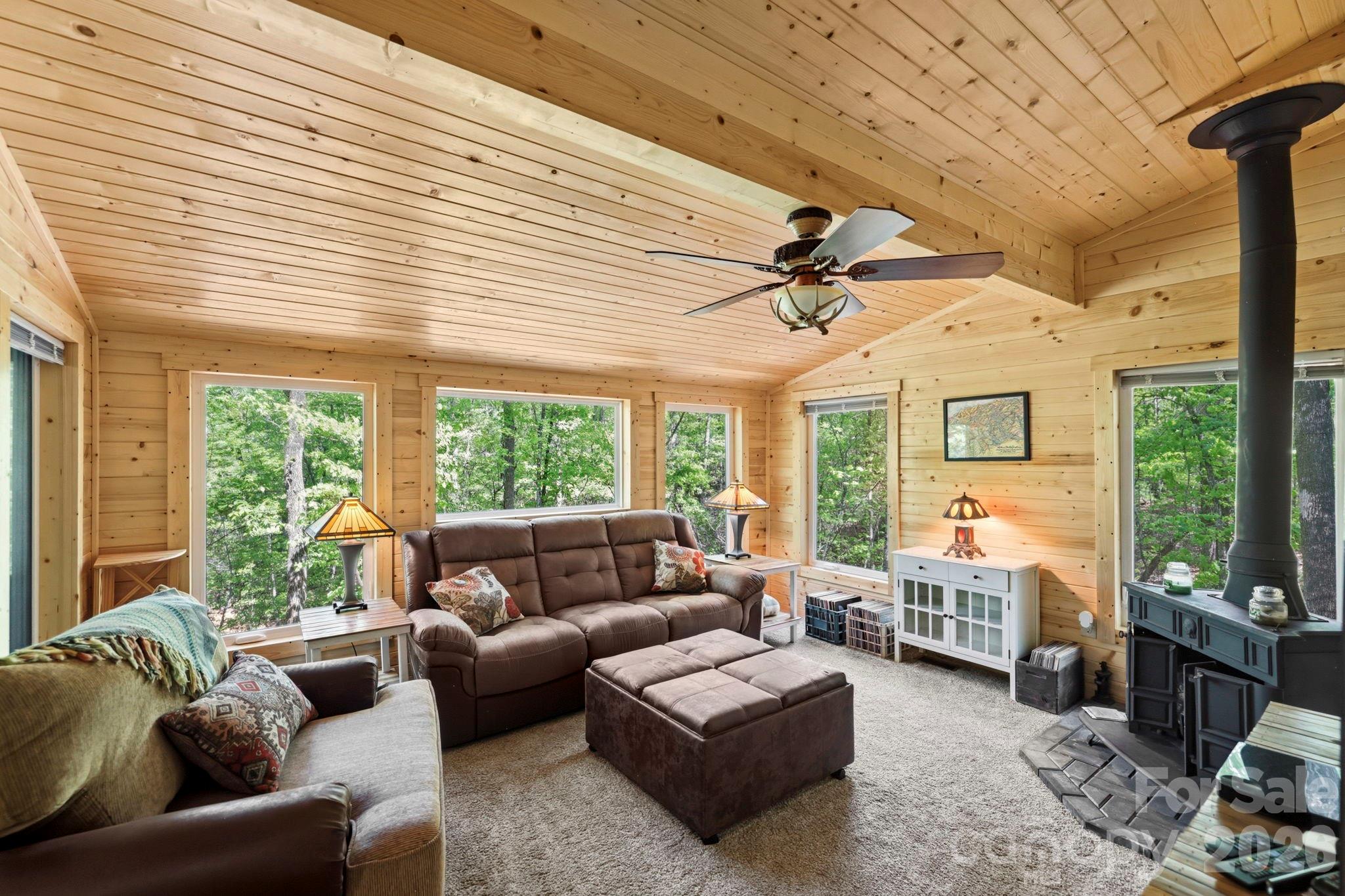 81 Delind Drive Mill Spring, NC 28756 - Photo 7 of 40 a living room with furniture and a large window