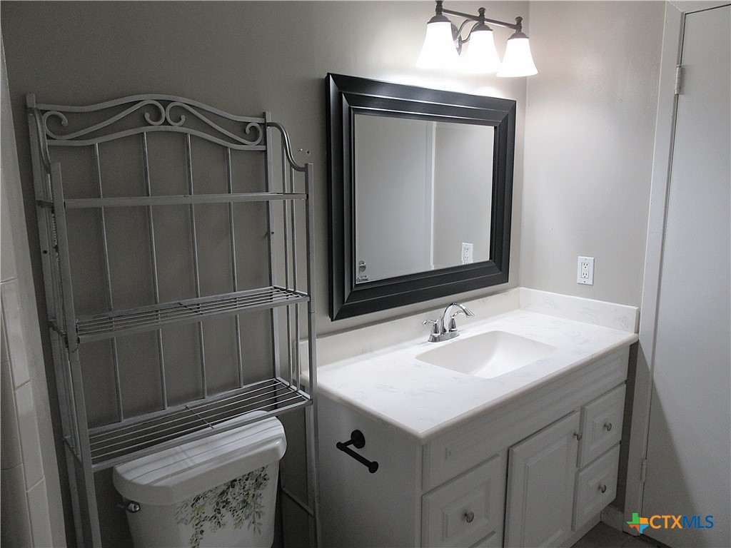 4113 Fox Trail Temple, TX 76504 - Photo 18 of 30 a bathroom with a sink a vanity and a mirror
