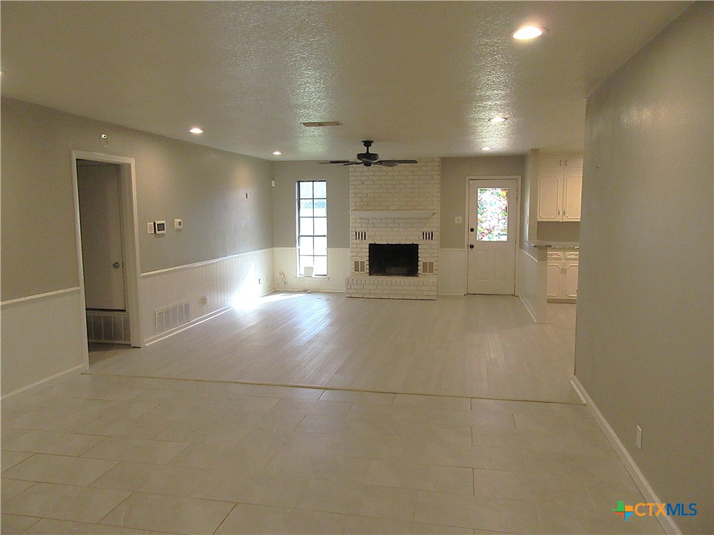 4113 Fox Trail Temple, TX 76504 - Photo 2 of 30 a view of an empty room and a kitchen