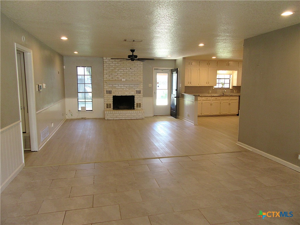 4113 Fox Trail Temple, TX 76504 - Photo 3 of 30 a view of a kitchen with a sink and a fireplace
