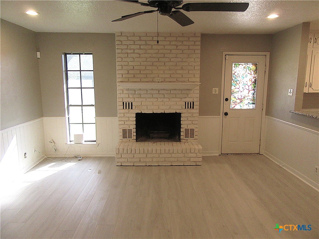 4113 Fox Trail Temple, TX 76504 - Photo 5 of 30 an empty room with windows and fireplace
