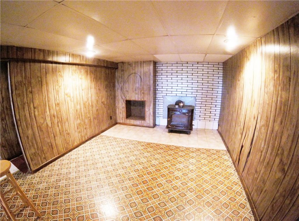 321 Concord Circle Road Beaver Falls, PA 15010 - Photo 15 of 25 The finished basement features a woodstove - ideal for a cozy feel while watching Steeler games!