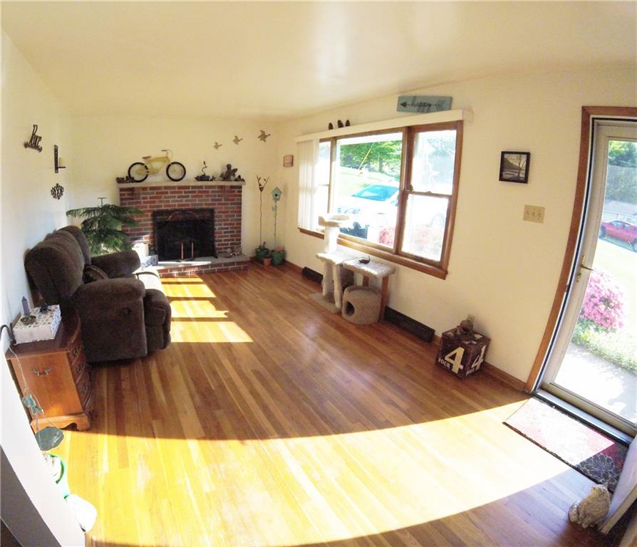 321 Concord Circle Road Beaver Falls, PA 15010 - Photo 3 of 25 The woodburning fireplace is a welcoming focal point of the living room...