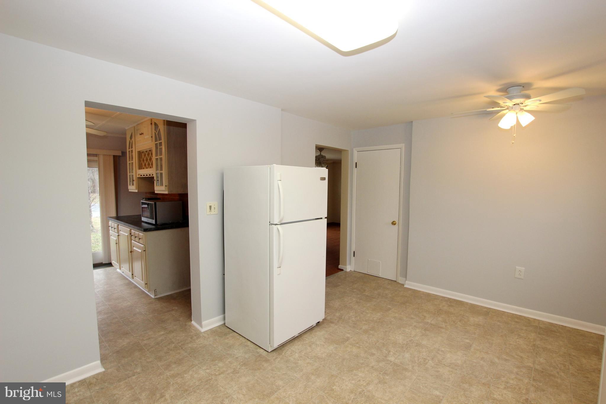 48 Apex Circle Ranson, WV 25438 - Photo 12 of 24 a view of a kitchen with a sink and a refrigerator