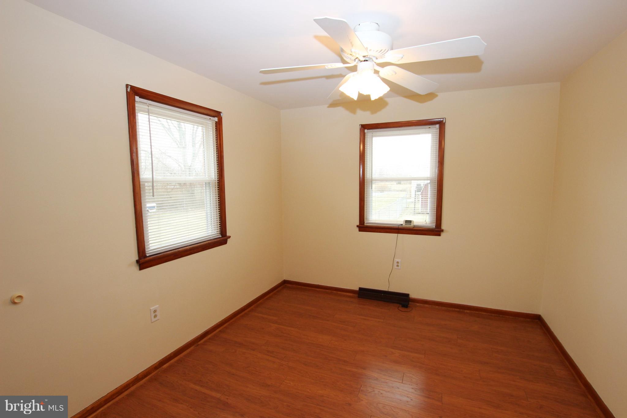 48 Apex Circle Ranson, WV 25438 - Photo 17 of 24 an empty room with wooden floor and windows