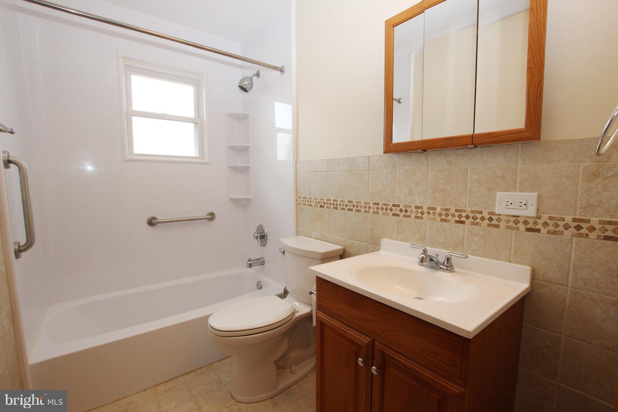48 Apex Circle Ranson, WV 25438 - Photo 19 of 24 a bathroom with a sink a toilet and shower
