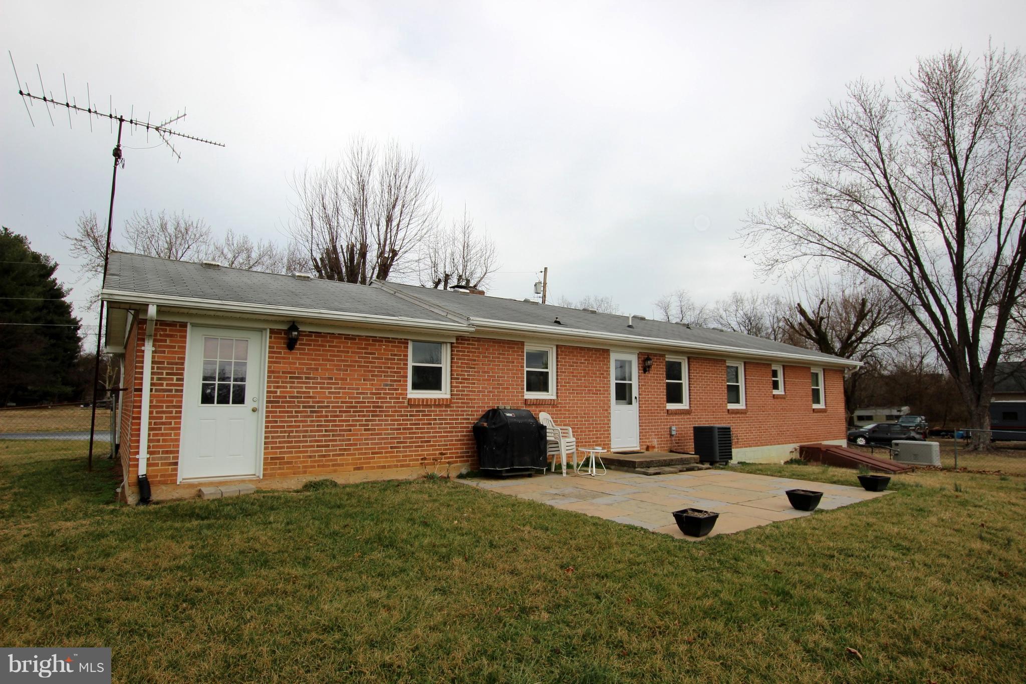 48 Apex Circle Ranson, WV 25438 - Photo 20 of 24 a view of a house with backyard and a tree